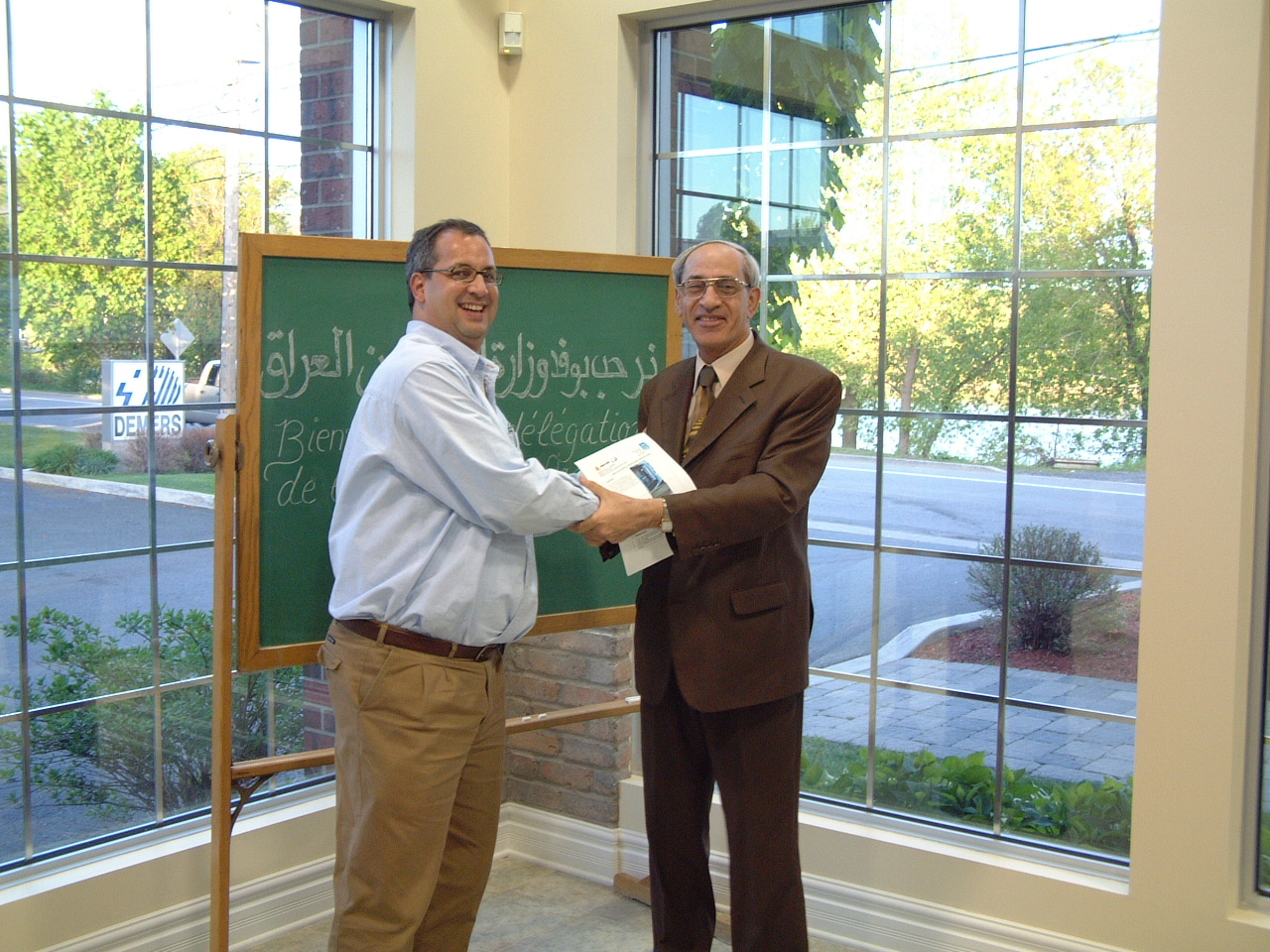 Luc Samson with an Iraqi delegation representative at the prototype acceptance